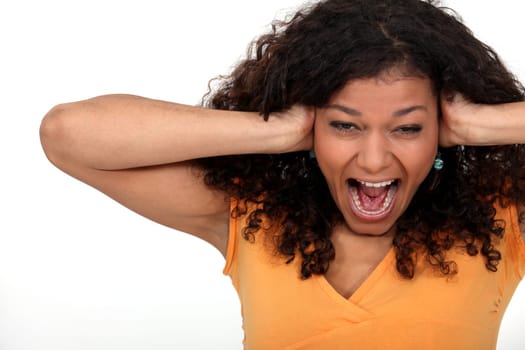 Woman covering her ears