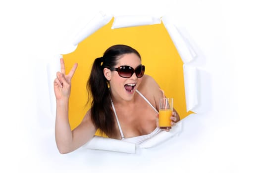 Woman coming out of hole with orange juice