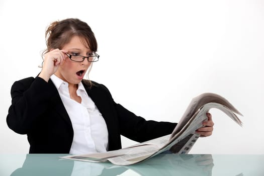 Businesswoman shocked at her newspaper