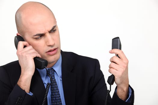 Man with two phones