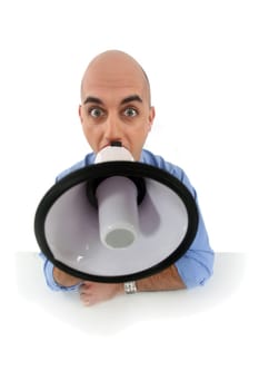 Bald man shouting into megaphone
