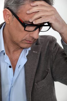 Stressed middle-aged businessman