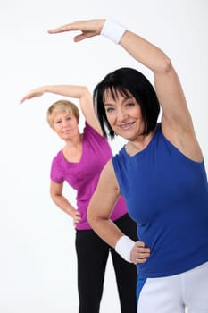 two senior women doing fitness