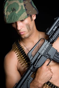 Army man holding machine gun