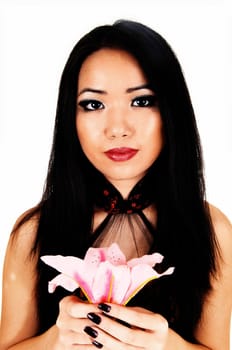 A beautiful young Chinese woman with long black hair in a portrait picture.holding a pink lily for white background..