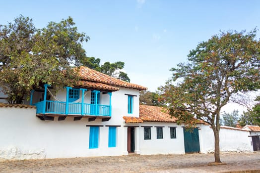 White colonial architecture with a light blue balcony in Villa de Leyva in Boyaca department in Colombia