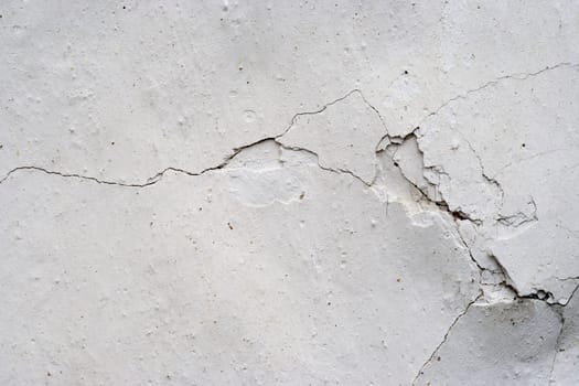 Grunge texture of the old and damaged stucco - plaster - fine cracks