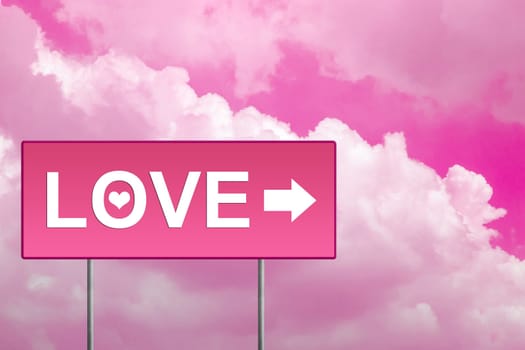 love on pink road sign with sky
