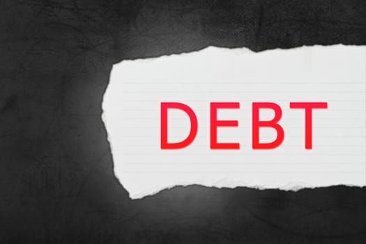 Debt with paper tears on black texture