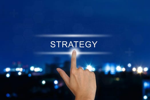 hand clicking strategy button on a touch screen interface