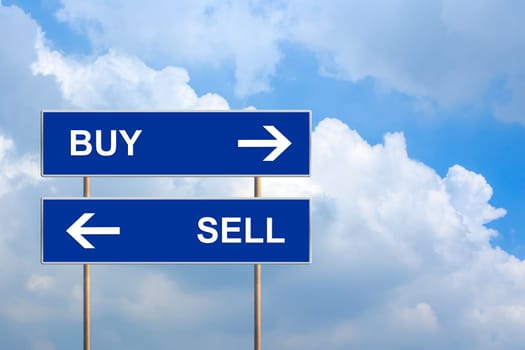 buy and sell on blue road sign with blue sky