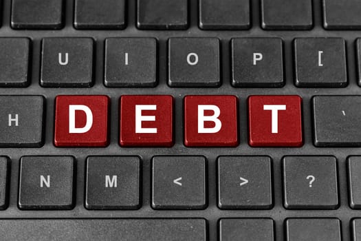 Debt red word on keyboard