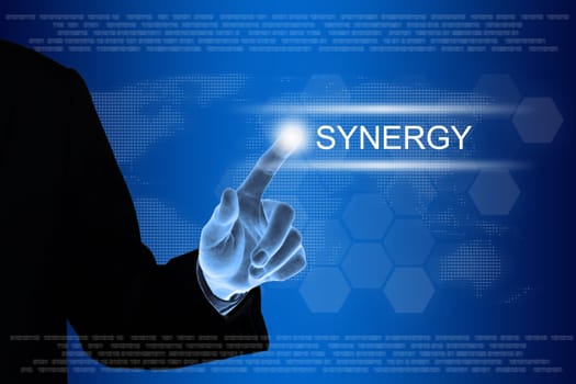 business hand pushing synergy button on a touch screen interface