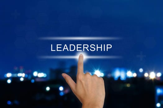 hand clicking leadership button on a touch screen interface