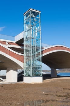 elevator for pedestrians and bicyclists next to a newly build bridge