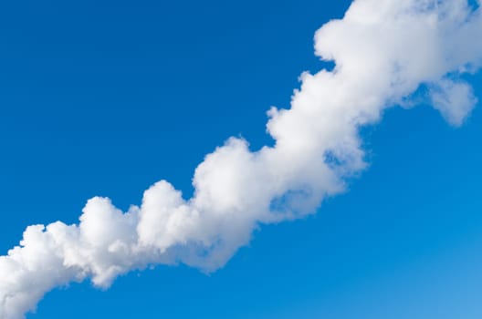 line of white smoke against a blue sky