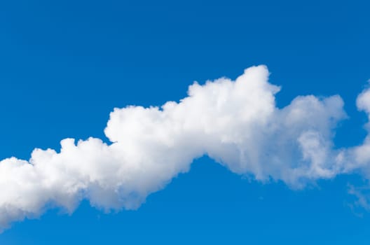 line of white smoke against a blue sky