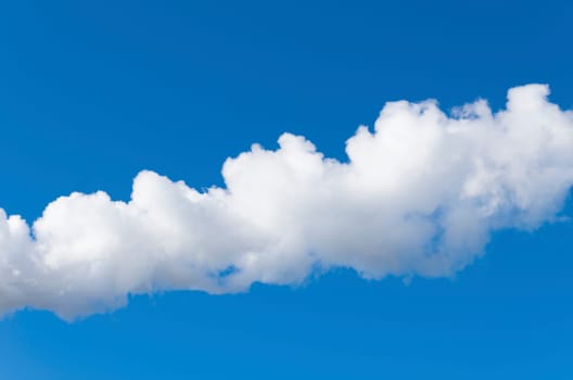 line of white smoke against a blue sky
