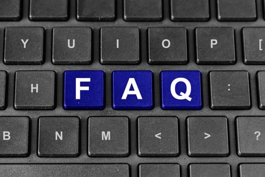 FAQ or Frequently asked questions blue word on keyboard
