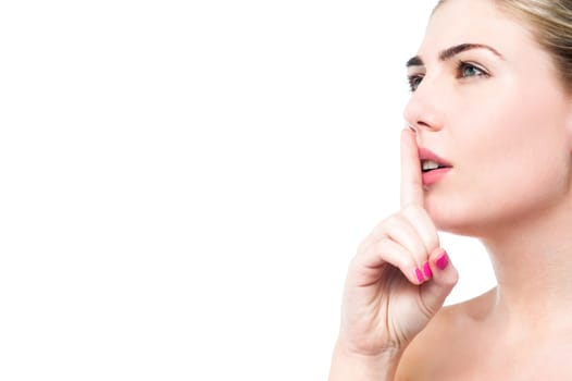 Attractive woman making a shushing gesture