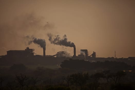 Suger mill near Malelane, Mpumalanga Province, as seen at dawn from Kruger National Park, South Africa