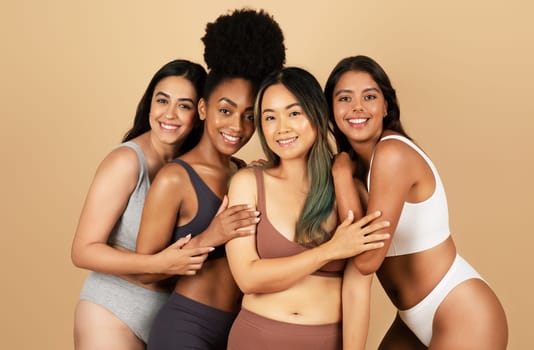 Four diverse women pose together, exuding confidence and natural beauty, standing wearing simple underwear, celebrating the essence of feminine diversity and elegance