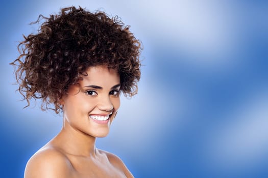 Attractive woman isolated on blue background