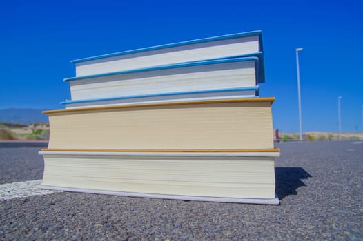 On the Road Literature Concept Books over Asphalt
