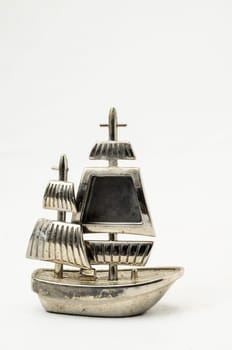 Metal Sailing Boat Figurine on a white background