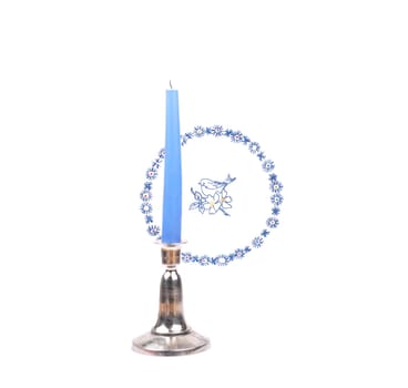 Candlestick in front of cloth