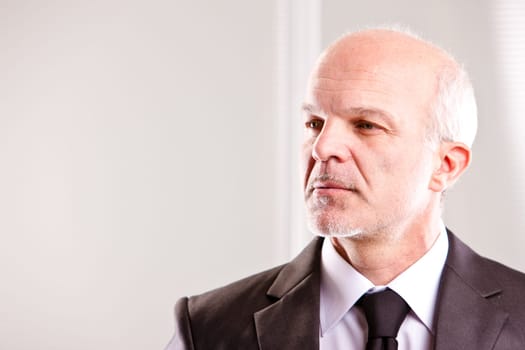 middle aged businessman looking into the future (looking left)