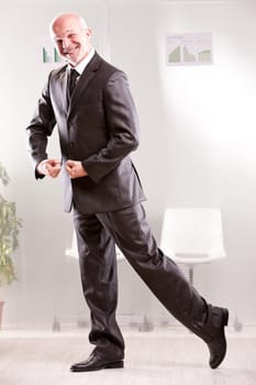 Goofy businessman pretending weightlifting  with his arms and foolish face