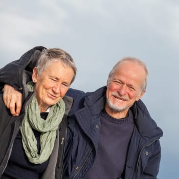 older seniors couple happy laughing in holiday leisure natural ostsee