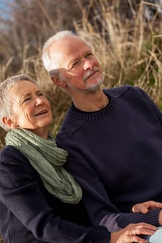 happy relaxed older couple out in the natural senior pensioner's leisure health old