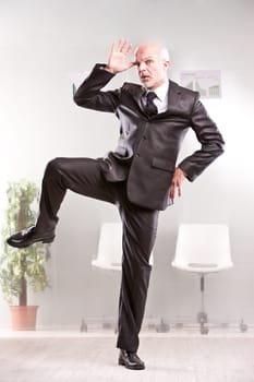 weird businessman thumbing his nose at