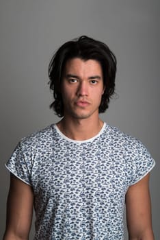 Portrait of handsome Malaysian man wearing flowery top