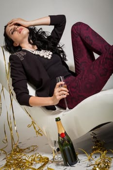 elegant attractive young woman with champagne and air snakes party outfit fashion celebration