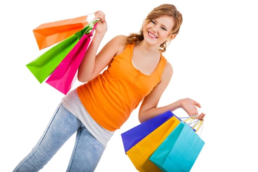 young attractive laughing woman isolated on shopping tour with colorful shopping bags