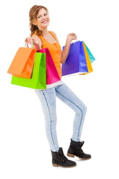 young attractive laughing woman isolated on shopping tour with colorful shopping bags