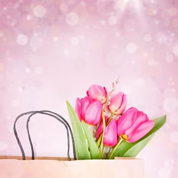 Pink tulips on colorful spring background