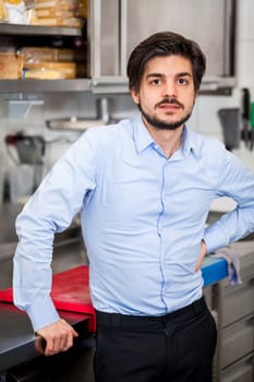 restaurant chef chef owner in the kitchen portrait proudly successful