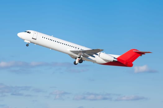 large passenger plane in the air before blue sky holiday travel transport