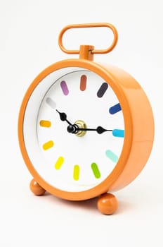 Orange Alarm Clock on a White Background