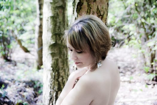 high key portrait of woman in woodland setting