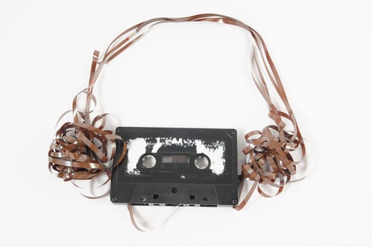 Ancient Vintage Used Musicassette over a White Background