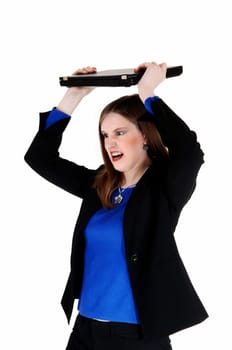 A young business woman in a black suit throwing her laptop very angry,.for white background..