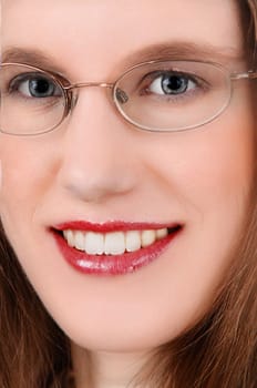 A closeup picture of a beautiful young woman with glasses, blue .eye's and red lips..
