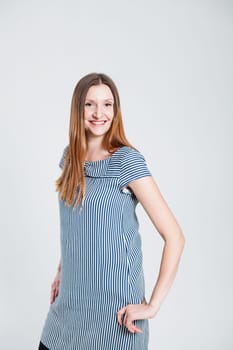 Studio portrait of smiling attractive and stylish woman posing