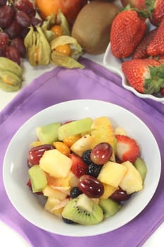 a white bowl with fresh fruit