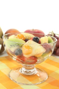 a cocktail bowl with fresh fruit salad